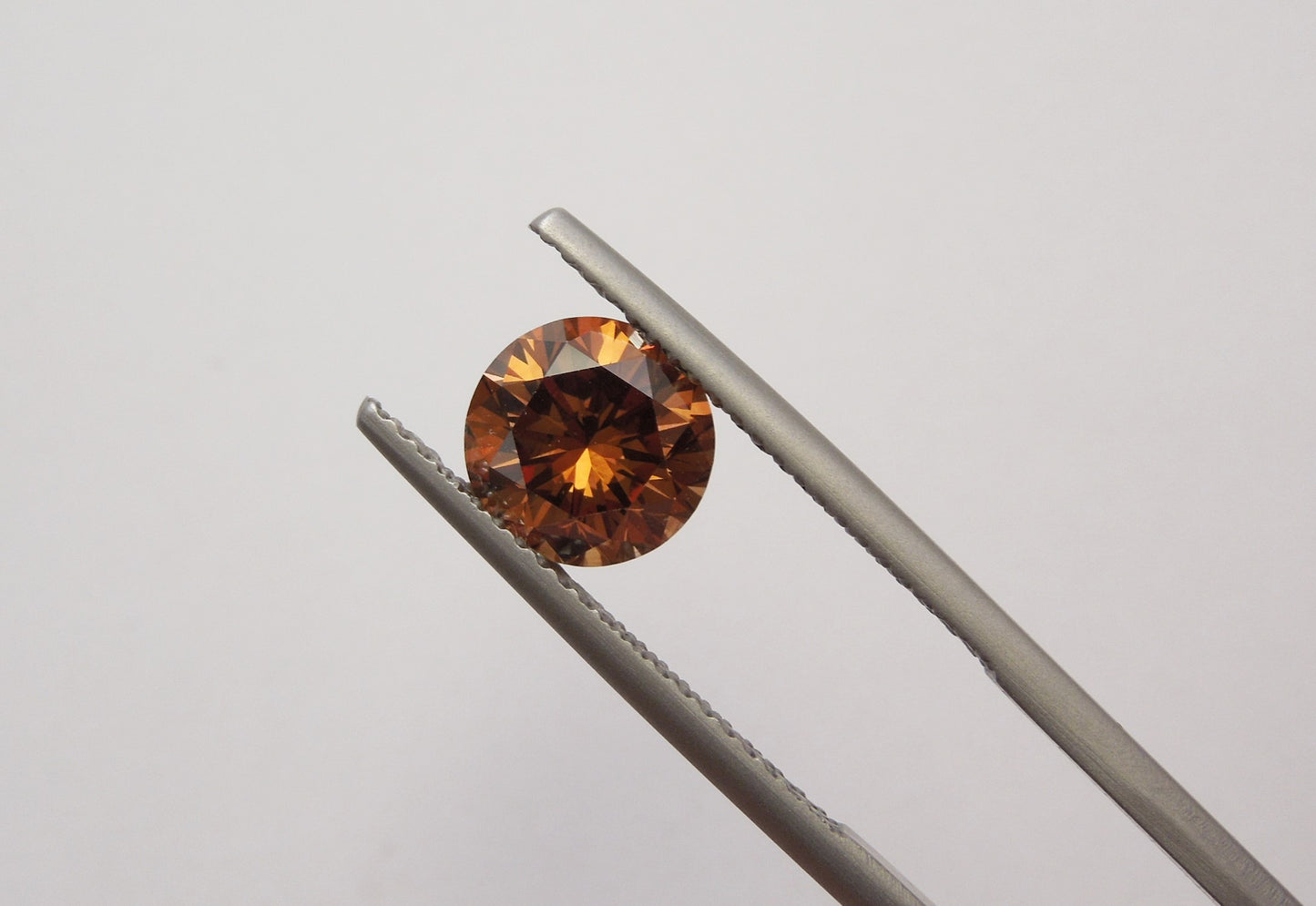 1.62ct Fancy Deep Orangy Brown, Round Diamond, VVS2 - 7.30 - 7.39 x 4.76mm