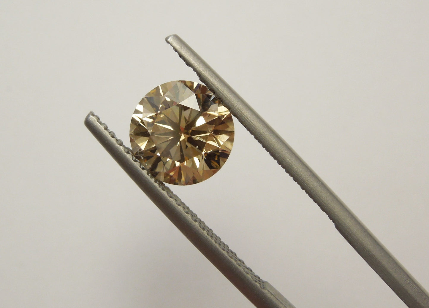 2.12ct Fancy Orangy Brown, Round Diamond, SI1 - 7.93 - 8.05 x 5.12mm